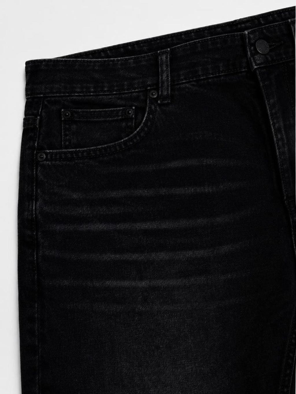 Close-up of the front pocket and stitching on 14 oz black stretch denim
