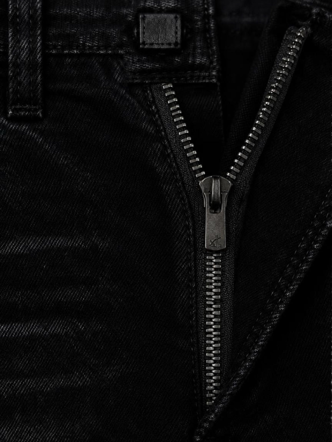 Close-up of the zip fly on CRZELOMARI Form Denim black stretch jeans